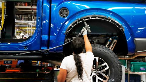A United Auto Worker member assembles a 2018 Ford F-150 truck at the Ford Rouge assembly plant, in Dearborn, Michigan in 2018. The Dearborn plant will assemble the all-electric Ford F150 Lightning, which will be available in the 2022 model year.