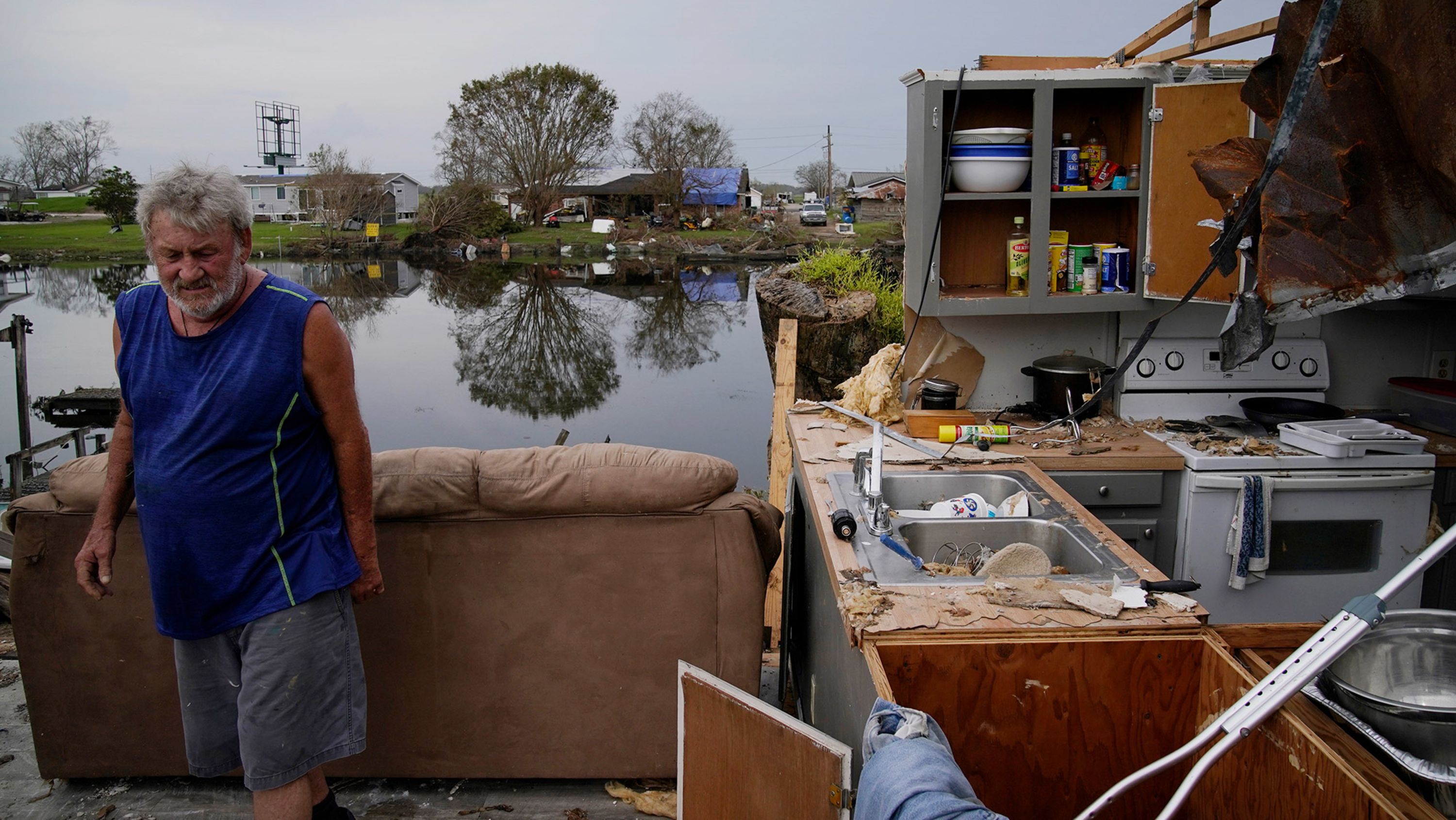 Philip Adams walks through what remains of his living room and kitchen at his destroyed home in Lockport, Louisiana, on Monday, September 6.