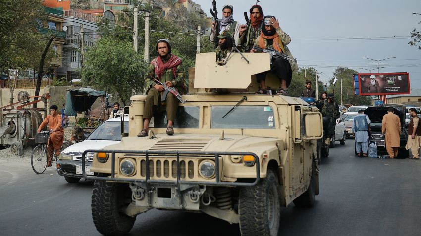 Taliban fighters atop a Humvee vehicle take part in a rally in Kabul on August 31, 2021 as they celebrate after the US pulled all its troops out of the country to end a brutal 20-year war -- one that started and ended with the hardline Islamist in power. (Photo by Hoshang Hashimi / AFP) (Photo by HOSHANG HASHIMI/AFP via Getty Images)