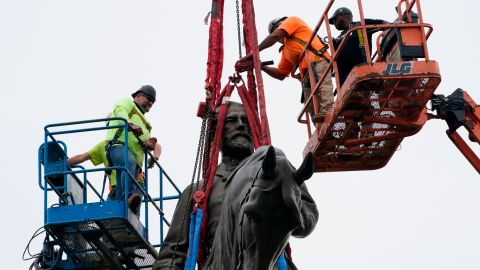 Crews work to remove one of the country's largest remaining monuments to the Confederacy, a towering statue of Confederate General Robert E. Lee on Monument Avenue, on Sept. 8, 2021, in Richmond, Va. 