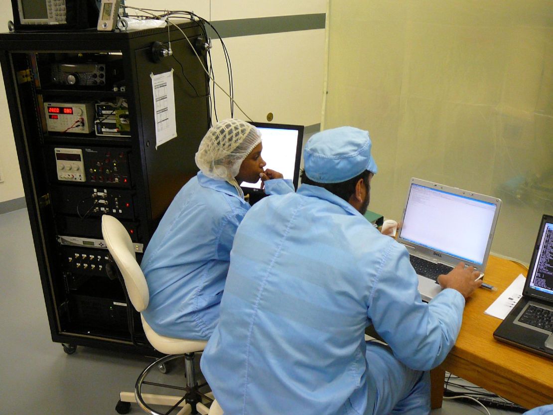 Astrofica's Jessie Ndaba and Khalid Manjoo testing SumbandilaSat, a South African micro earth observation satellite, in 2009.