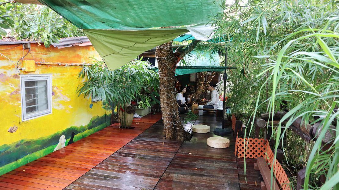 Visitors take part in tea meditation on the deck.