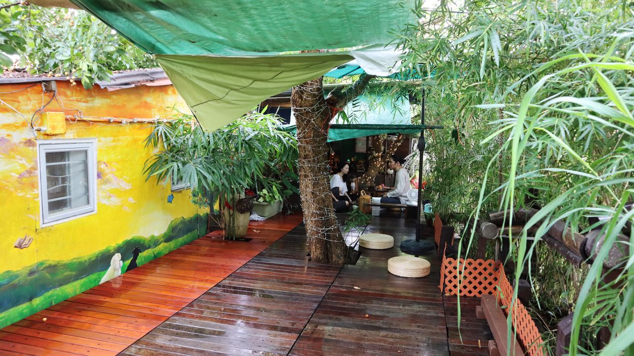 Visitors take part in tea meditation on the deck.