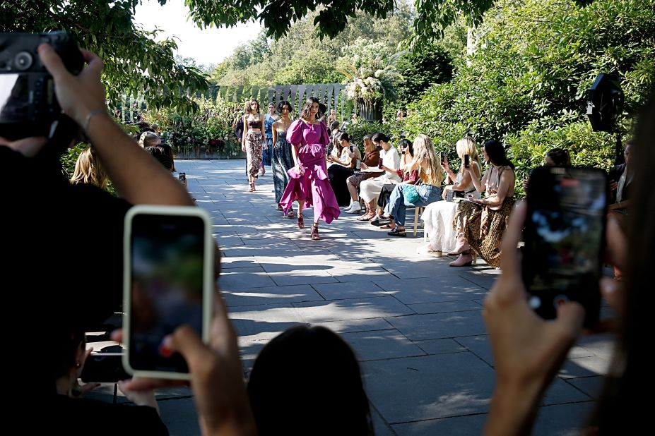 Guests captured the moment at Ulla Johnson's runway show, which was held at the Brooklyn Botanic Garden.