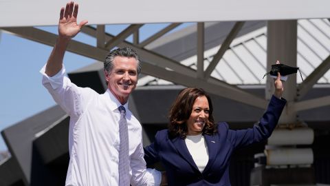 California Gov. Gavin Newsom and Vice President Kamala Harris wave during a campaign event at the IBEW-NECA Joint Apprenticeship Training Center in San Leandro on Wednesday.