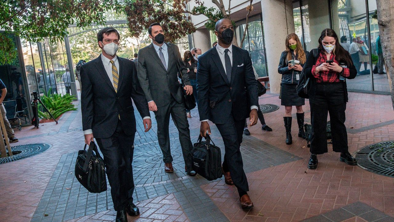 Lawyers in the fraud trial of Elizabeth Holmes, the founder and former CEO of blood testing and life sciences company Theranos, arrive for the first day of the trial, outside Federal Court in San Jose, California.