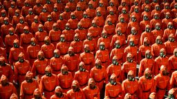 Personnel in orange hazmat suits march during a paramilitary parade held to mark the 73rd founding anniversary of the republic at Kim Il Sung square in Pyongyang in this undated image supplied by North Korea's Korean Central News Agency on September 9, 2021.    KCNA via REUTERS    ATTENTION EDITORS - THIS IMAGE WAS PROVIDED BY A THIRD PARTY. REUTERS IS UNABLE TO INDEPENDENTLY VERIFY THIS IMAGE. NO THIRD PARTY SALES. SOUTH KOREA OUT. NO COMMERCIAL OR EDITORIAL SALES IN SOUTH KOREA.     TPX IMAGES OF THE DAY