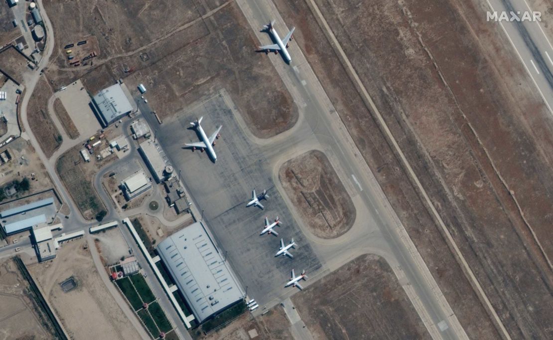 A handout satellite image made available by Maxar Technologies shows airplanes near the main terminal at Mazar-i-Sharif Airport, northern Afghanistan, on September 3, 2021.