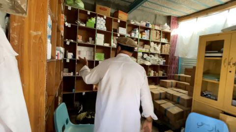 Khan displays the hospital's stock room, as concern grows over access to healthcare in the country.