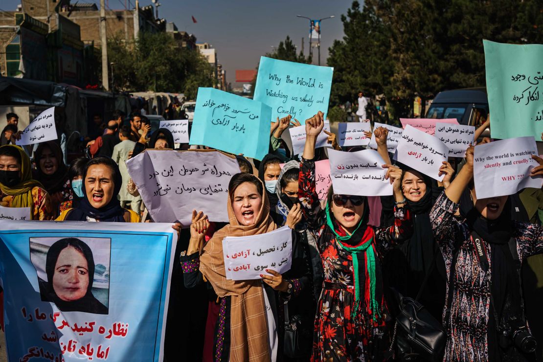 Women march through the Dashti-E-Barchi neighborhood of Kabul on Wednesday, September 8, a day after the Taliban announced a new all-male interim government.