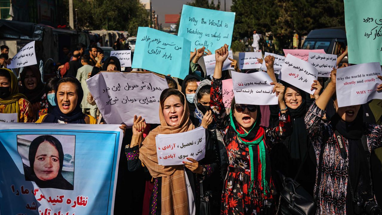 Women march through the Dashti-E-Barchi neighborhood of Kabul on Wednesday, September 8, a day after the Taliban announced a new all-male interim government.