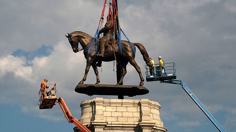 The statue of Confederate General Robert E. Lee is removed from its pedestal on Monument Avenue on September 8, 2021 in Richmond, Virginia. 