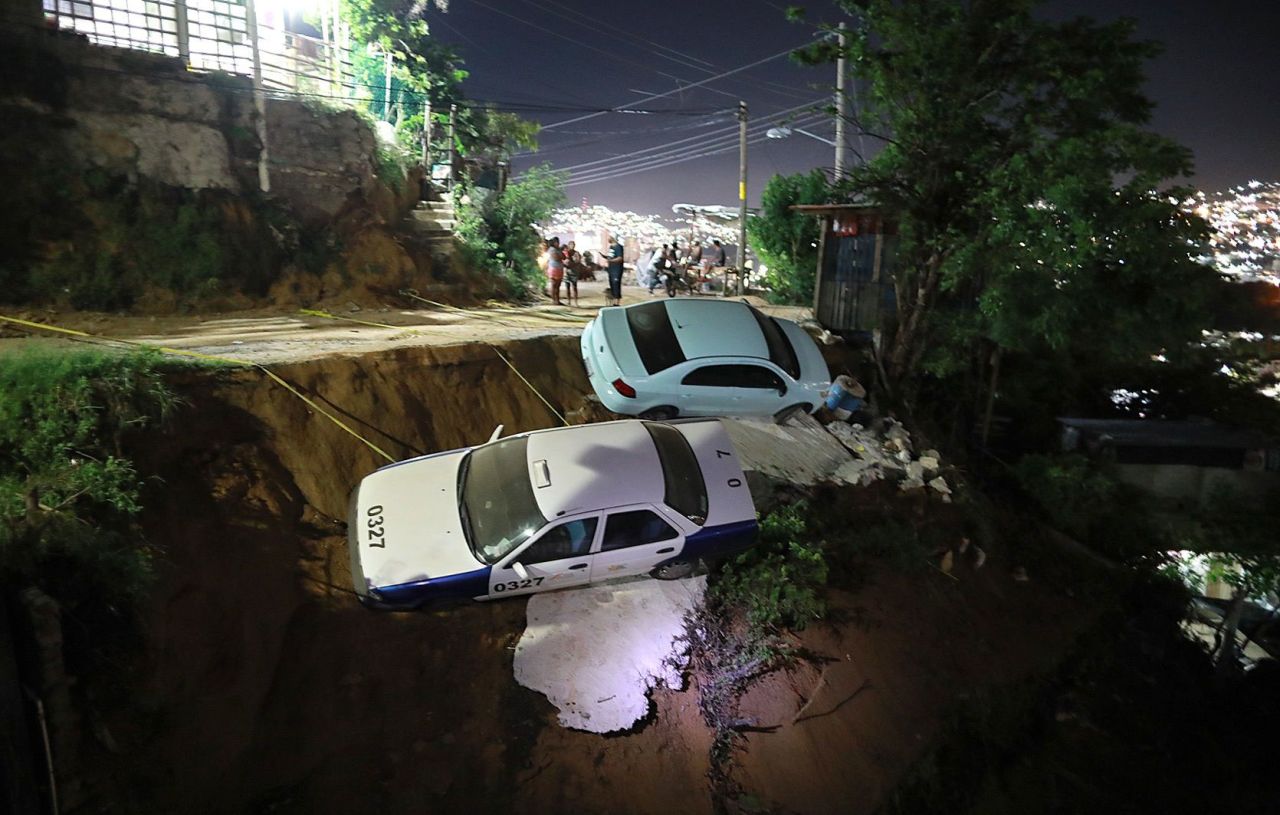 Vehicles are seen on the side of a cliff in Acapulco, Mexico, after a <a href="https://www.cnn.com/2021/09/07/americas/mexico-earthquake/index.html" target="_blank">7.0 magnitude earthquake</a> struck the country's southwest on Tuesday, September 7.