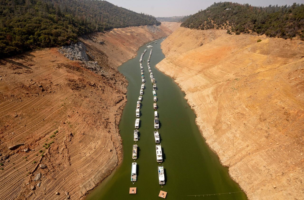 Houseboats sit in a depleted Lake Oroville in Oroville, California, on Sunday, September 5. Lake Oroville was at 23% of its capacity and suffering from extreme levels of drought. <a href="https://www.cnn.com/2021/06/27/weather/gallery/western-drought-heat/index.html" target="_blank">In pictures: The West's historic drought</a>