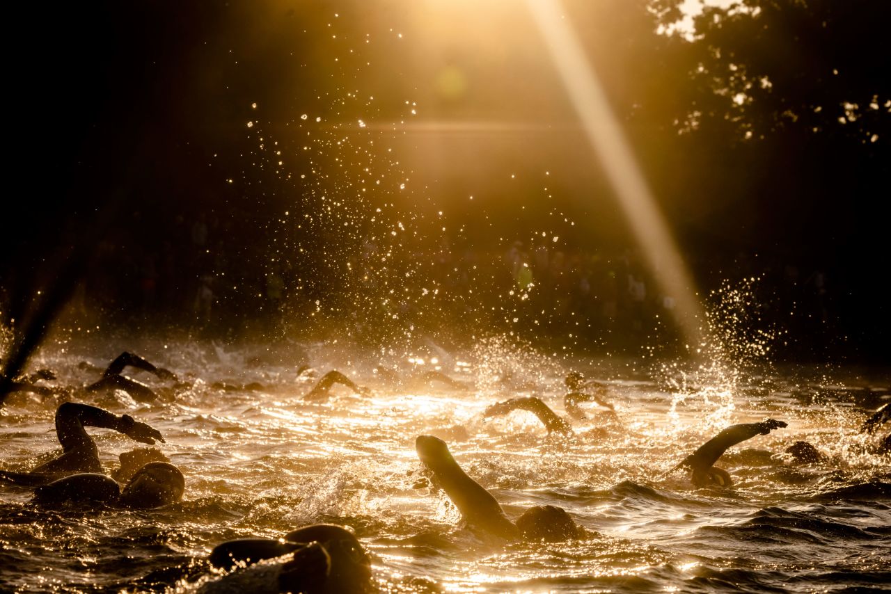 Triathletes swim during the Challenge Roth event in Roth, Germany, on Sunday, September 5.