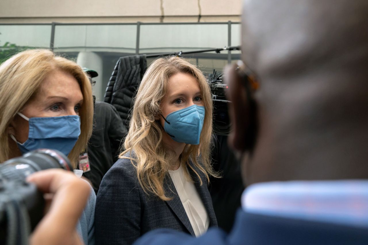 Elizabeth Holmes, center, arrives for <a href="https://www.cnn.com/2021/09/08/tech/elizabeth-holmes-theranos-trial-opening-statements/index.html" target="_blank">opening arguments in her criminal trial</a> in San Jose, California, on Wednesday, September 8. Holmes, the founder of the failed blood-testing startup Theranos, has pleaded not guilty to charges that she intended to mislead investors, patients and doctors about the capabilities of her company.