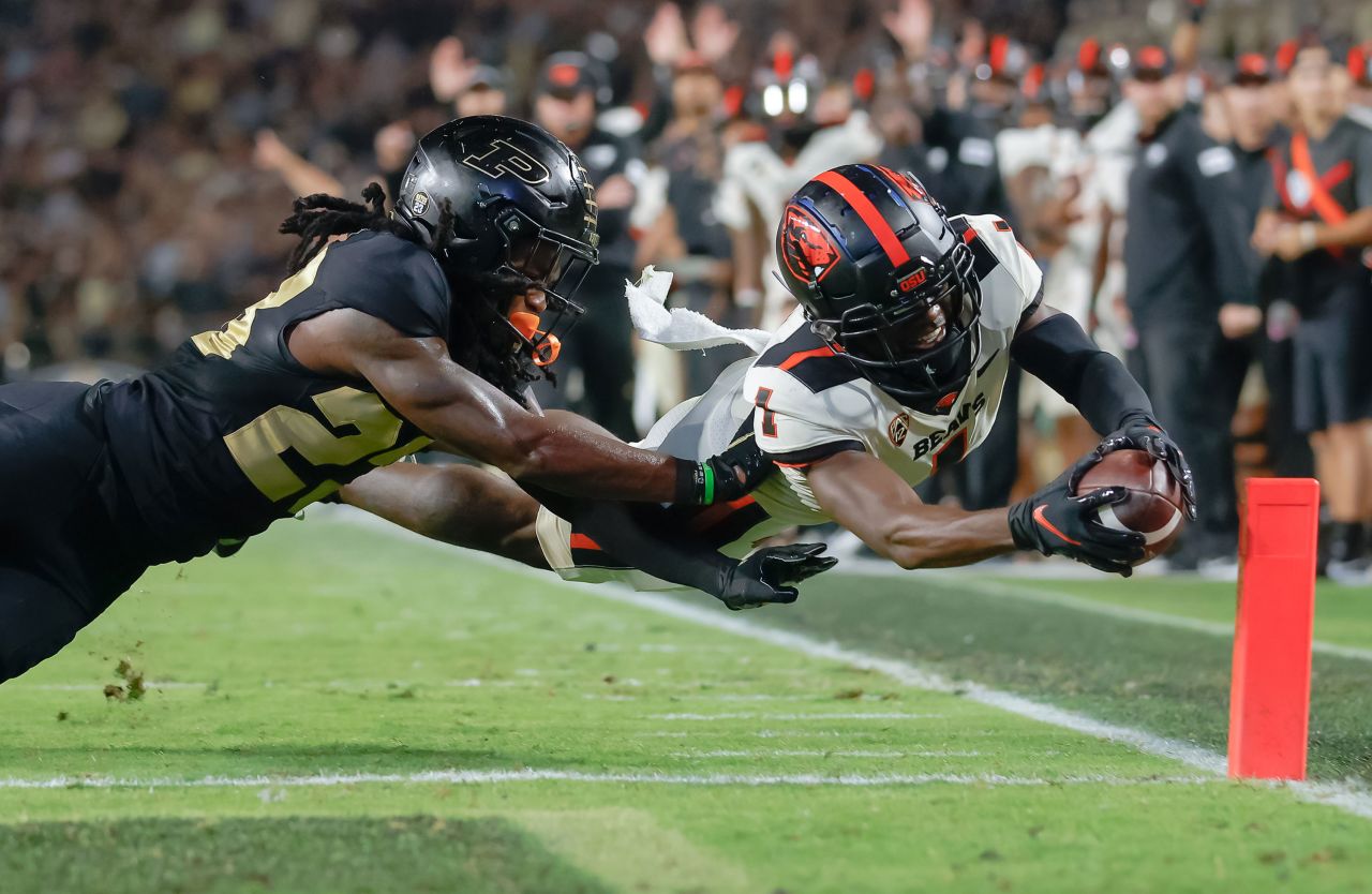 Oregon State's Tyjon Lindsey reaches over the goal line to score a touchdown against Purdue during a college football game in West Lafayette, Indiana, on Saturday, September 4. Purdue won 30-21.