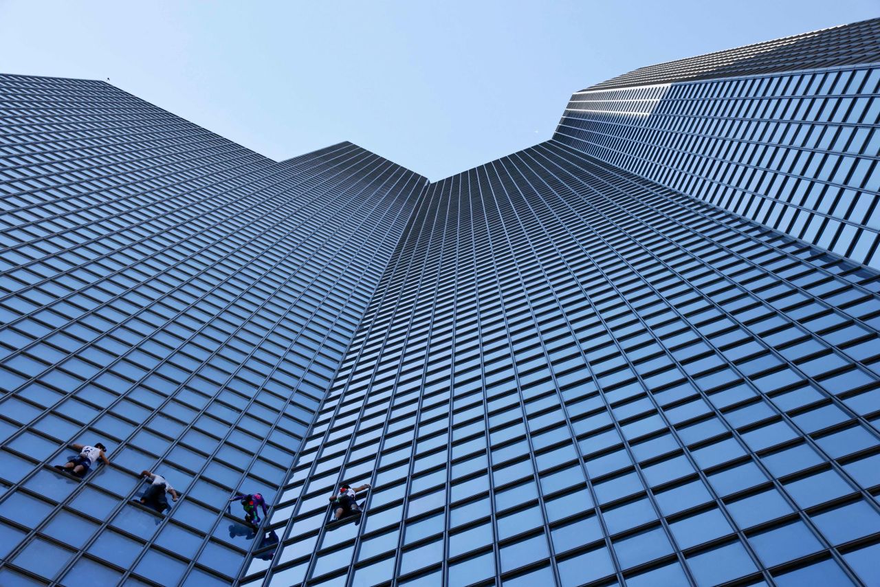 The "French Spiderman," urban climber Alain Robert, is seen second from right as he climbs the Total tower on the outskirts of Paris along with Marcin Banot, Alexis Landot and Leo Urban on Tuesday, September 7. Robert said he climbed the skyscraper <a href="https://www.euronews.com/2021/09/07/french-spider-man-climbs-paris-tower-to-protest-covid-health-pass" target="_blank" target="_blank">to protest the Covid-19 health pass</a> that's required for certain activities in France.