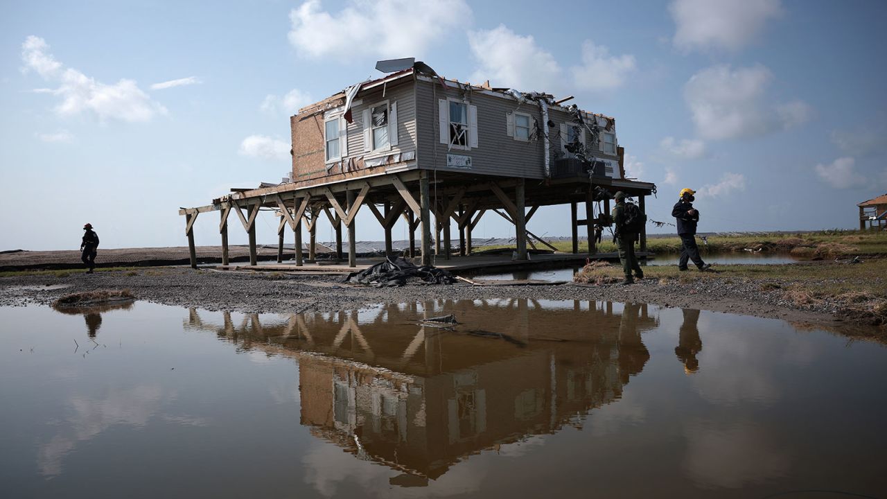 A search and rescue team checks homes in Grand Isle, Louisiana. 