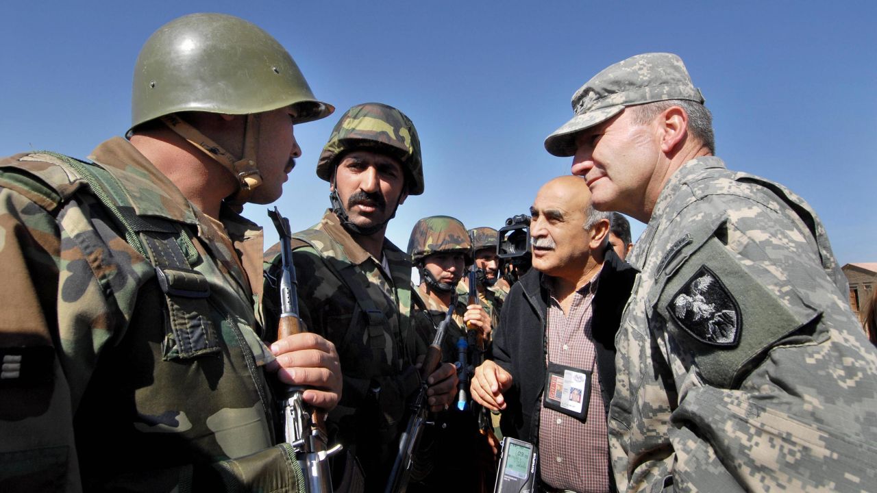 Lt. Gen. Karl Eikenberry, a commander in Afghanistan from 2005 to 2007, speaks with Afghan National Army soldiers at their remote firebase near the Pakistani border in the Barmal district of southeastern Paktika province, in October 2006.  