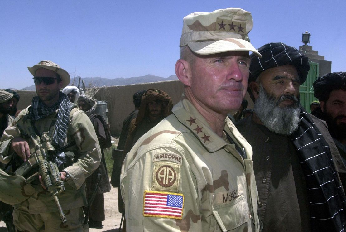 US Army General Dan McNeill, the commander of coalition forces in Afghanistan, speak to reporters in July 2002. McNeill had just met with local elders in the village of Deh Rawud in southern Afghanistan. 