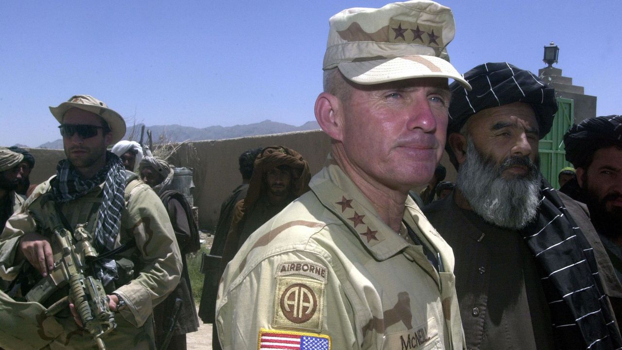 US Army General Dan McNeill, the commander of coalition forces in Afghanistan, speak to reporters in July 2002. McNeill had just met with local elders in the village of Deh Rawud in southern Afghanistan.