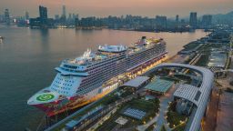 The Genting Dream cruise ship is moored at the Kai Tak Cruise terminal in this panorama by drone in Hong Kong, China, 23 Jul 2021. Hong Kong is about to allow fully vaccinated ''cruises to nowhere'' starting in August. (Photo by Marc Fernandes/NurPhoto via Getty Images)