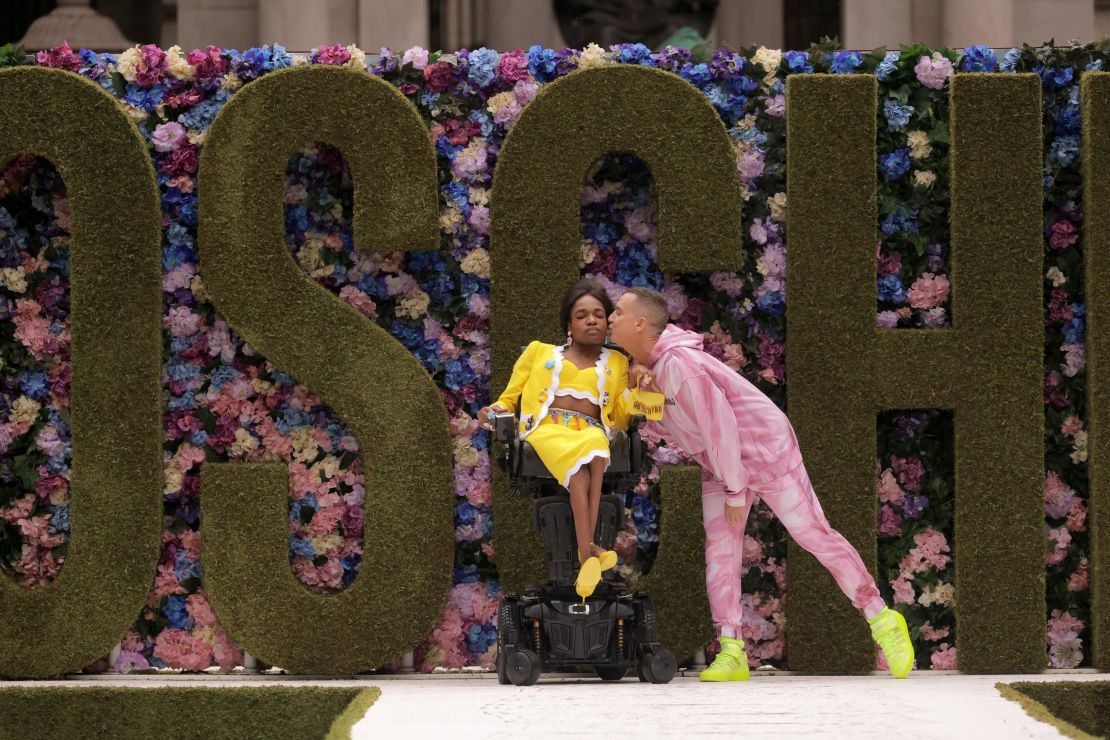 Aaron Rose Philip, pictured here with Moschino's creative director Jeremy Scott at New York Fashion Week in September.