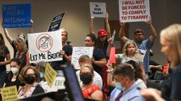 VIERA, FLORIDA, UNITED STATES - 2021/08/30: People demonstrate with placards at an emergency meeting of the Brevard County, Florida School Board in Viera to discuss whether face masks in local schools should be mandatory. 
An executive order signed by Florida Governor Ron DeSantis banning mask mandates in schools was thrown out by a Florida judge on Friday. (Photo by Paul Hennessy/SOPA Images/LightRocket via Getty Images)