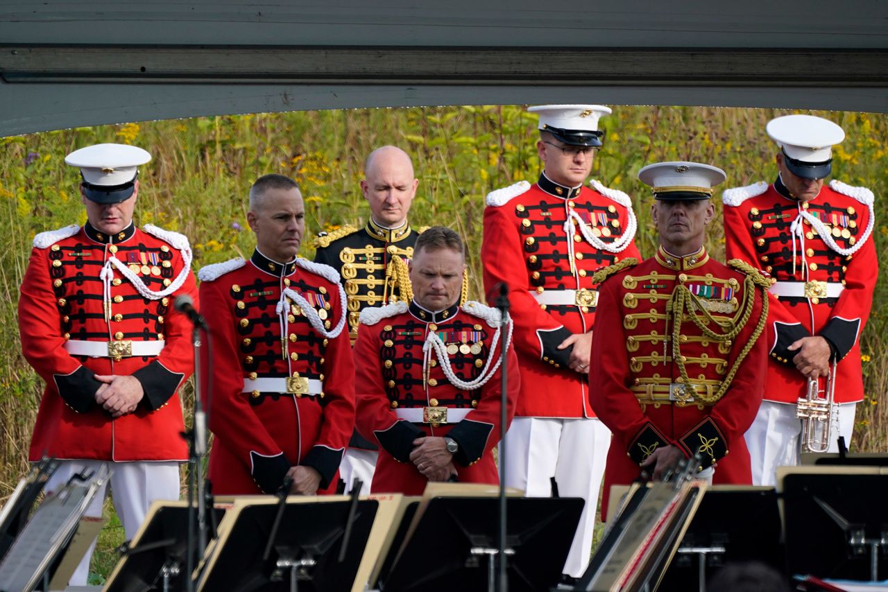 Members of the US Marine Band observe a moment of silence before performing at the Flight 93 National Memorial near Shanksville. Forty passengers and crew members aboard United Airlines Flight 93 died when the plane crashed into a field.