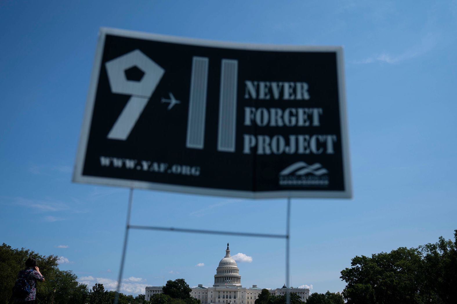 A sign for the 9/11 Never Forget Project is displayed on the National Mall in Washington, DC. Young America's Foundation, a conservative youth organization, created the project.