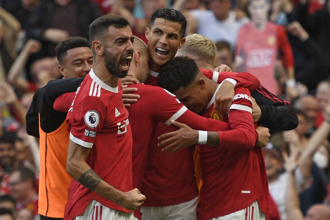 Ronaldo celebrates with teammates after scoring.