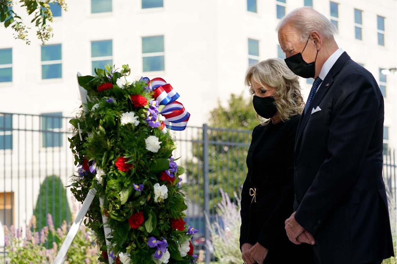 President Joe Biden and first lady Jill Biden participate in a wreath-laying ceremony at the Pentagon.