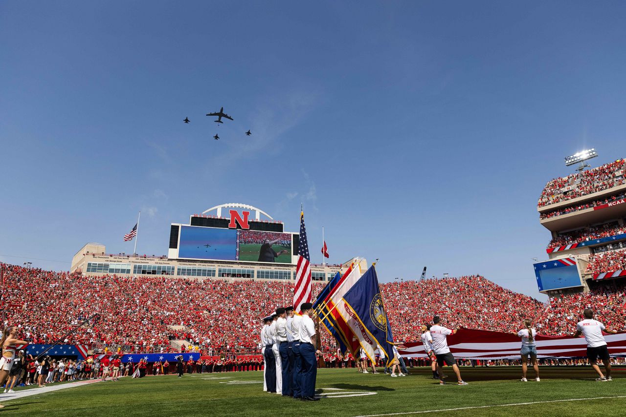 To commemorate the anniversary of 9/11, military planes fly over Memorial Stadium in Lincoln, Nebraska, as the national anthem is played before Nebraska faced Buffalo in a college-football game Saturday.