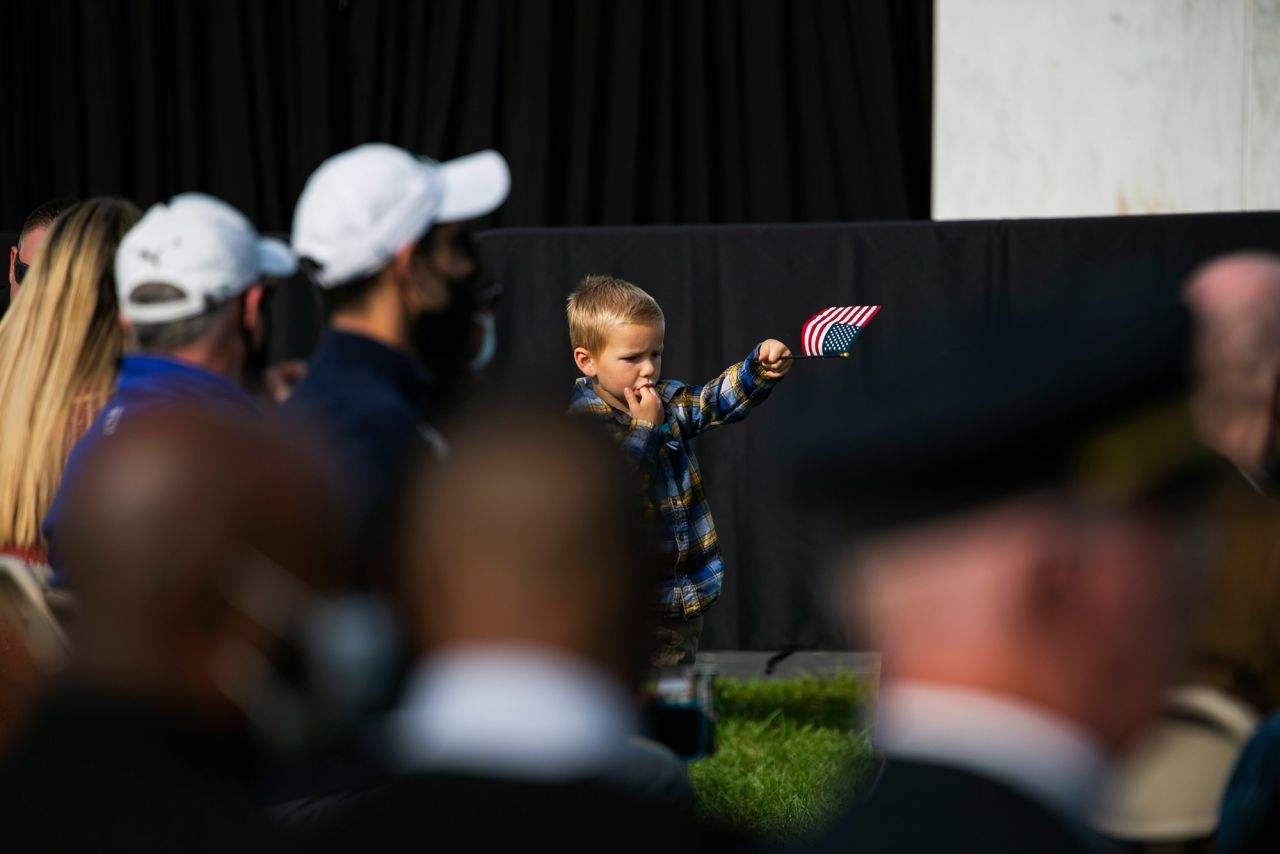 A young boy holds a flag during the ceremony near Shanksville.
