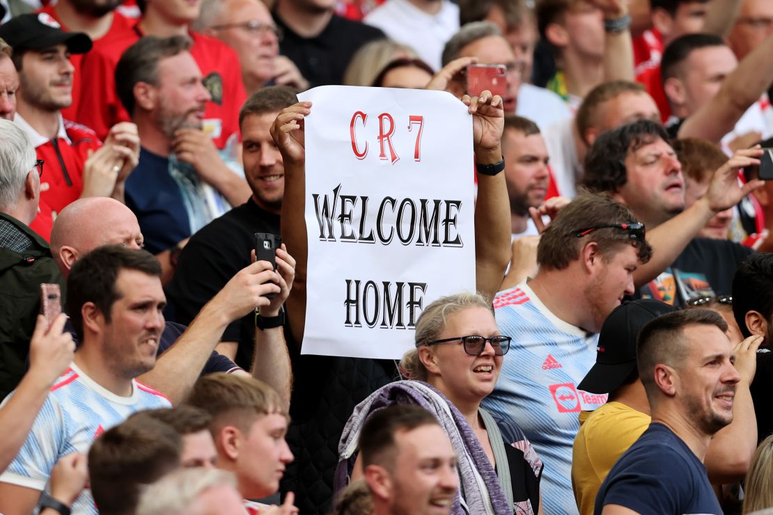 A fan holds aloft a 'CR7 Welcome Home' sign up during the match between Manchester United and Newcastle.