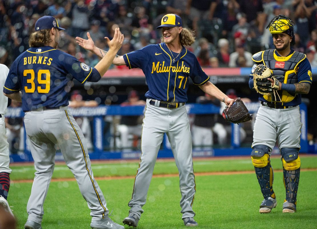 Brewers starting pitcher Corbin Burnes (39) greets relief pitcher Josh Hader as Omar Narvaez watches at the end of a baseball game against the Cleveland Indians on Saturday.