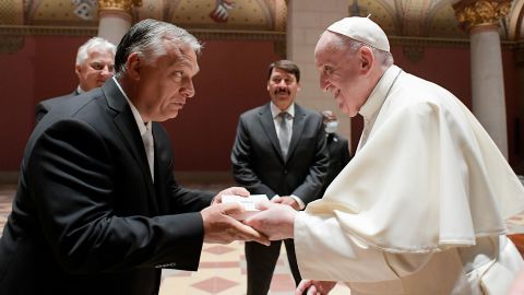 Pope Francis exchanges gifts with Hungarian Prime Minister Viktor Orban in Budapest.  
