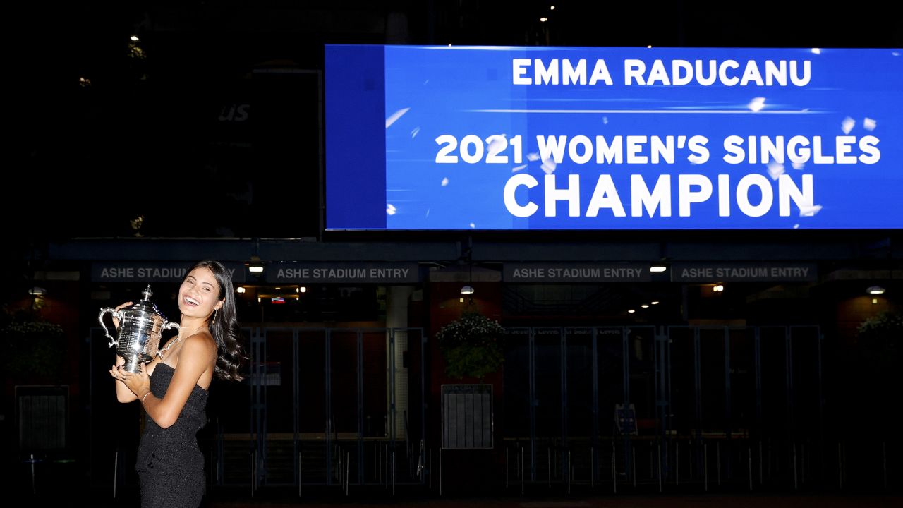 Raducanu Britain poses with the championship trophy after defeating Fernandez.