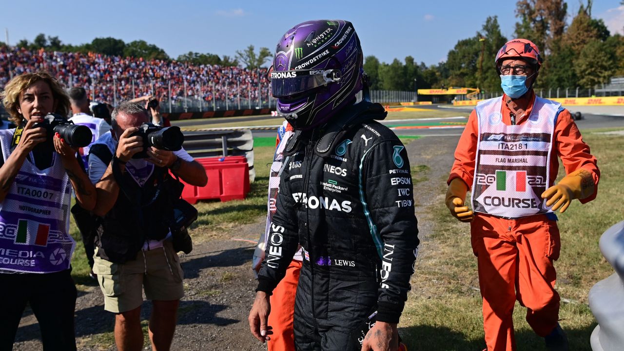 Hamilton walks out of the track after a collision with Verstappen.