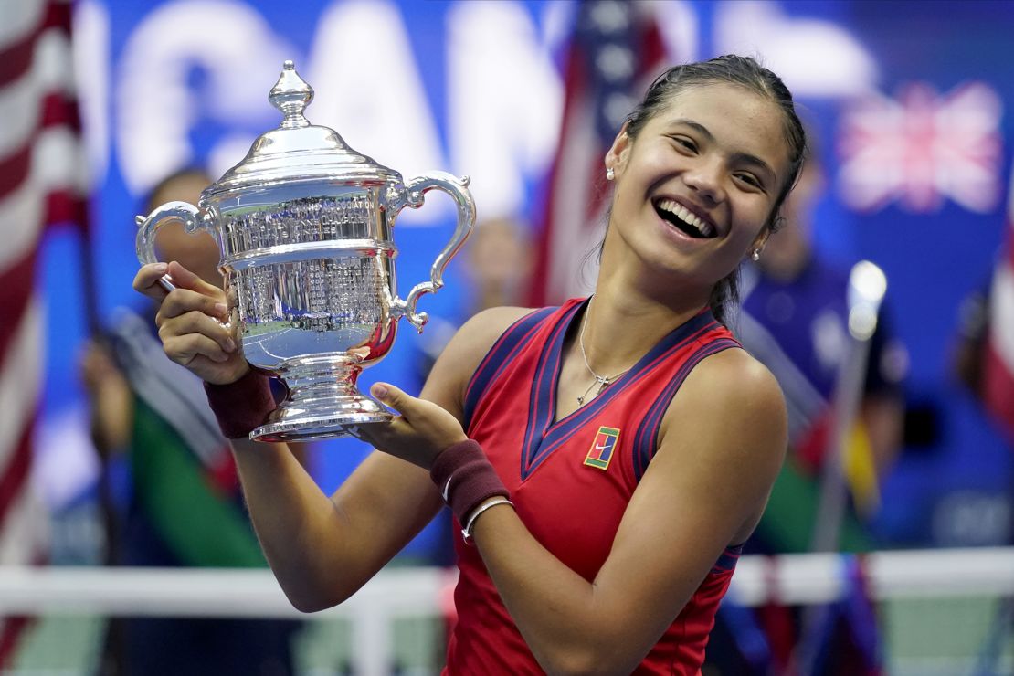 Emma Raducanu holds up the US Open championship trophy after winning the tennis tournament on September 11 in New York.