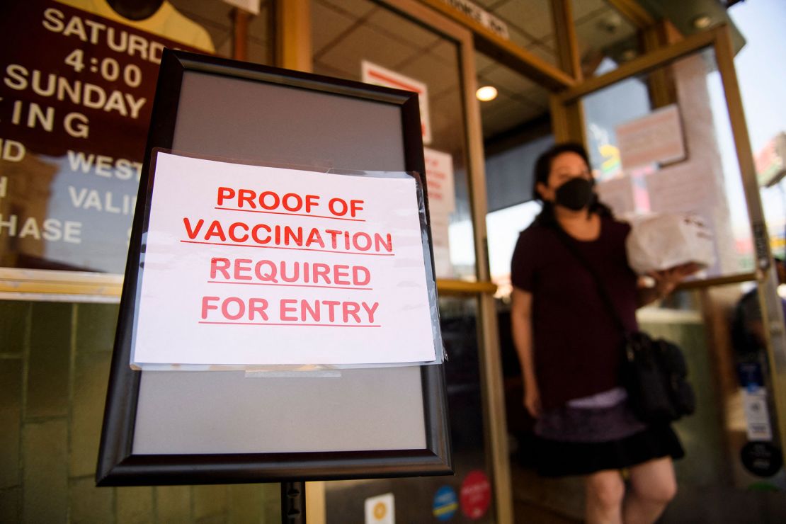 A sign outside of Langer's Deli in Los Angeles on August 7 stating proof of a Covid-19 vaccination is required for entry.