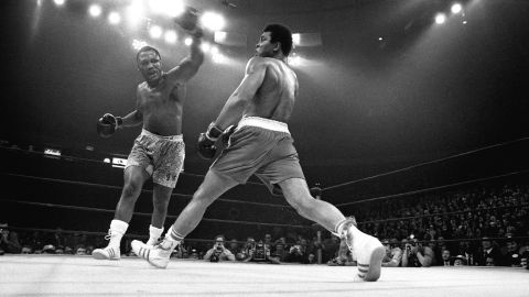 Muhammad Ali evades a punch from Joe Frazier during "The Fight of the Century" at Madison Square Garden in New York, March 8, 1971.