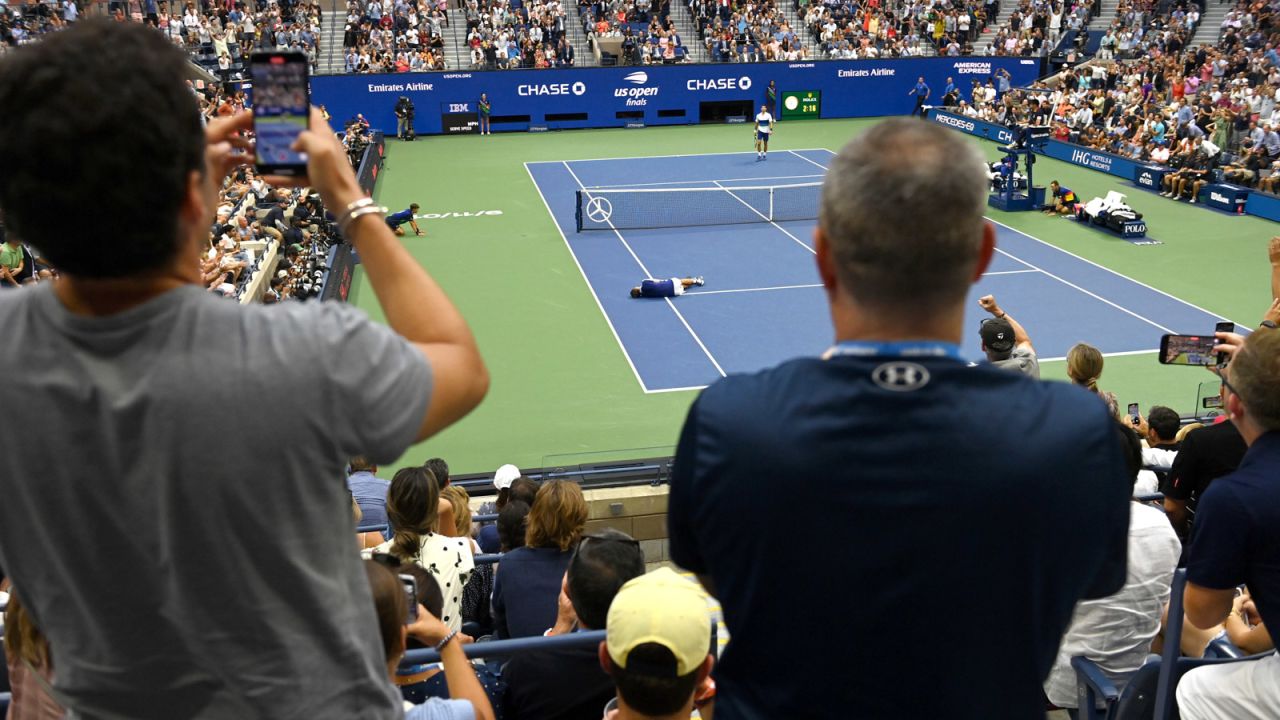 Medvedev reacts to his win against Djokovic at the US Open.