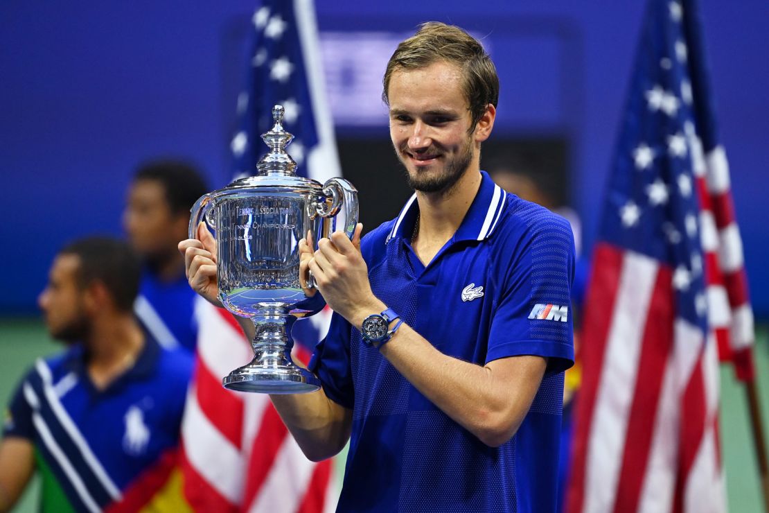 Medvedev celebrates with the US Open tophy -- his first major title. 