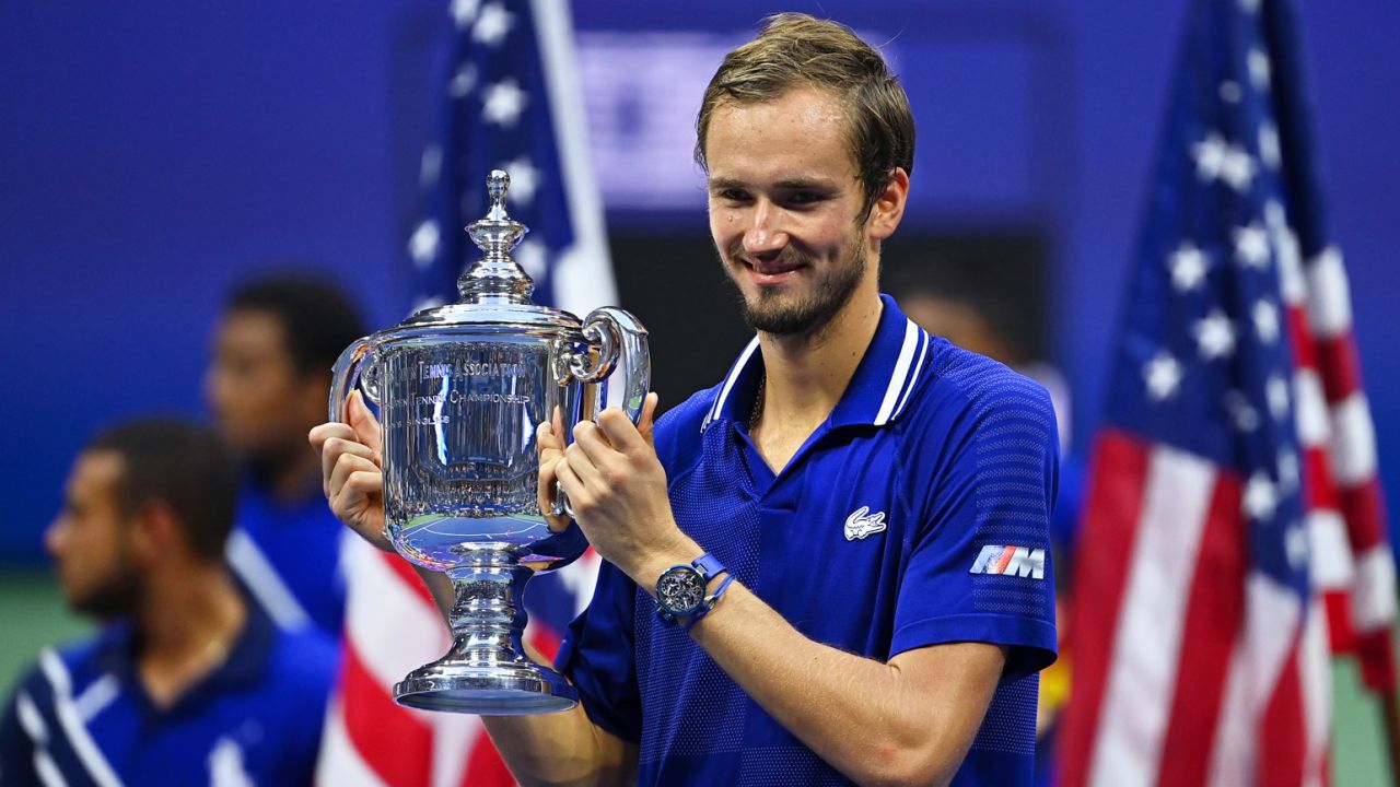 Medvedev celebrates with the US Open tophy -- his first major title.