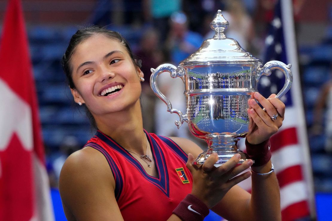 Britain's Emma Raducanu celebrates with the trophy after winning the 2021 US Open.