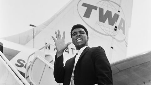 Cassius Clay, before he changed his name to Muhammad Ali, photographed en route back to the US after beating Henry Cooper in 1963.