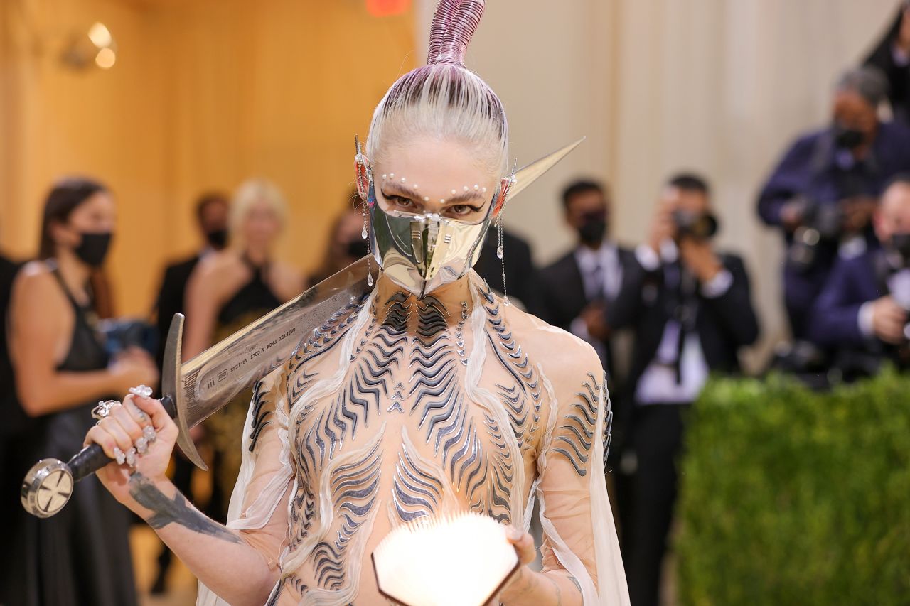 Grimes went full sci-fi and was inspired by "Dune," she said during Vogue's livestreamed coverage of the event. The musician carried a sword made from melted-down guns -- the work of MSCHF, the art collective behind Lil Nas X's controversial "Satan" shoes.