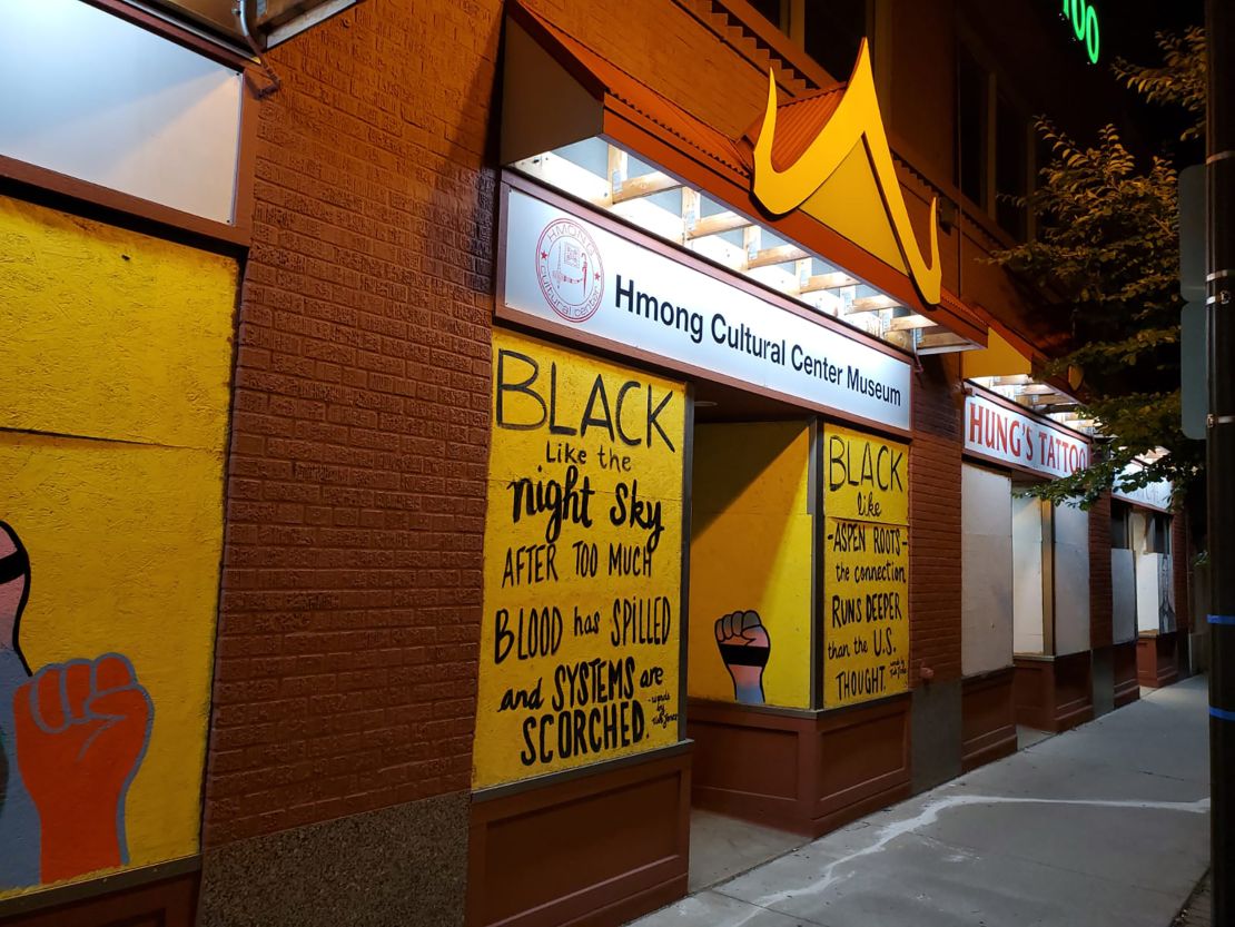 Before the vandalism, the front of the cultural center had a new sign and bright yellow frontage.